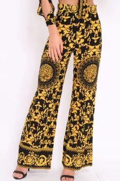 Rebellious Fashion Black and Gold Print High Waist Flare Trousers -Tisha
