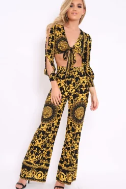 Rebellious Fashion Black and Gold Print High Waist Flare Trousers -Tisha