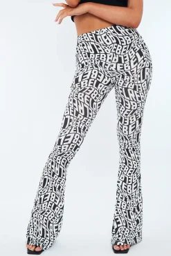 Rebellious Fashion Black White Rebel Print Flare Trousers - Indy