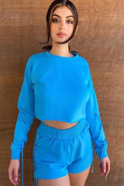 Rebellious Fashion Blue Eyelet Lace Up Cropped Sweatshirt - Ramaya