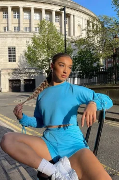 Rebellious Fashion Blue Eyelet Lace Up Cropped Sweatshirt - Ramaya