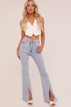 Rebellious Fashion Light Blue Front Slit Flared Leg Jeans - Macie