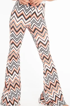 Rebellious Fashion Orange Black and White Zig-Zag Print Flared Trousers - Mianna