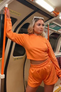 Rebellious Fashion Orange Hip Cut Out Elasticated Shorts - Zaleia