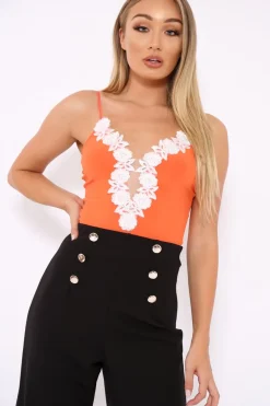Rebellious Fashion Orange Slinky Bodysuit with Floral Embroidery - Adila