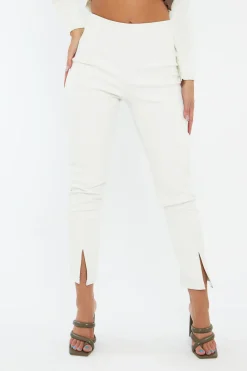 Rebellious Fashion White PU Leather Front Slit Trousers - Caro
